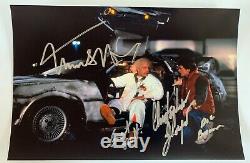 Back to the Future cast signed autographed 8x12 photo Michael J. Fox Lloyd COA