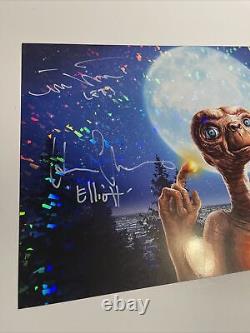 E. T. The Extra Terrestrial Cast signed 11x17 Holographic Poster Spielberg JSA