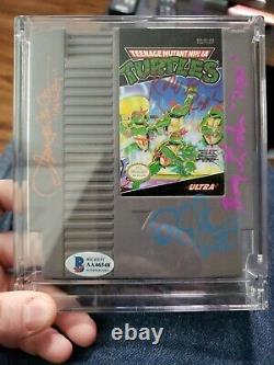 TMNT -Multi Signed Cast Nintendo game Gordon, Clarke, Paulsen, Coleman in protector